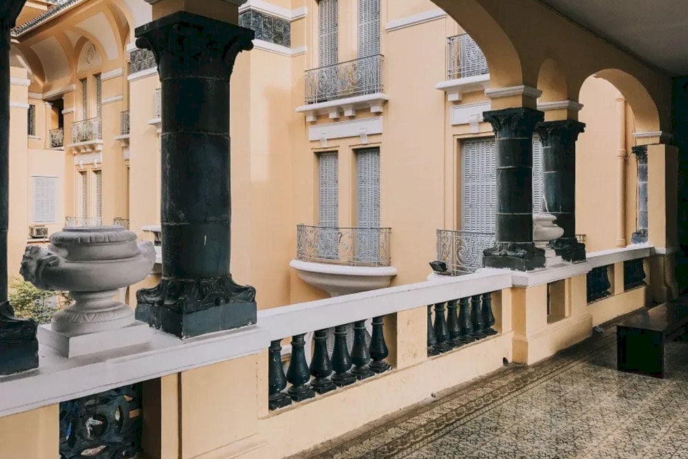 The hallways, with their vintage lighting and patterned tile floors, add a timeless and artistic touch to any shot